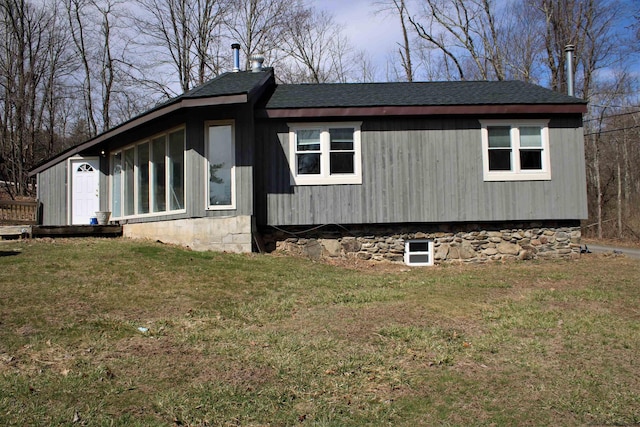 view of property exterior featuring a lawn