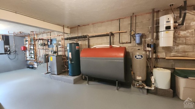 utility room featuring heating fuel, water heater, a heating unit, and a central vacuum unit