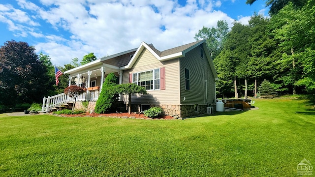 view of front of home featuring a porch and a front yard