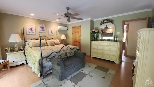 bedroom with a wall unit AC, wood finished floors, recessed lighting, ornamental molding, and a ceiling fan