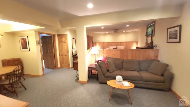 living area with baseboards, recessed lighting, and carpet floors