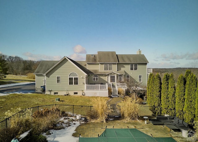 27 Gallagher Ln, Pleasant Valley, NY 12569 - back of property with a chimney and outdoor lounge area