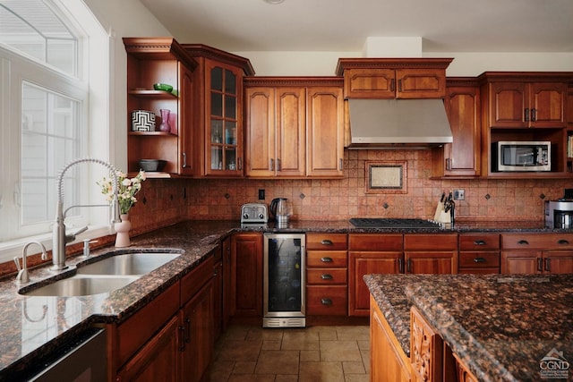 27 Gallagher Ln, Pleasant Valley, NY 12569 - kitchen with wine cooler, stainless steel microwave, a sink, exhaust hood, and tasteful backsplash