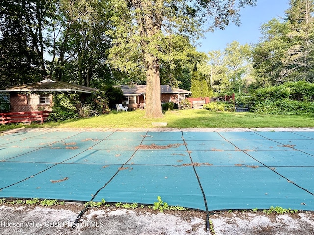 24 Linden Ave, Red Hook, NY 12571 - view of pool featuring a covered pool, a lawn, and view of scattered trees