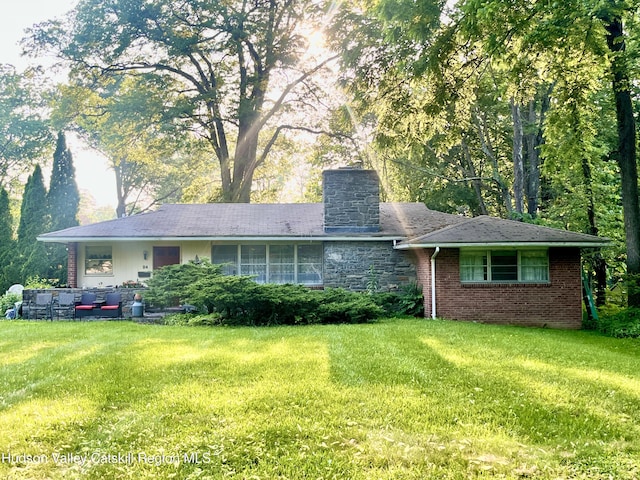 24 Linden Ave, Red Hook, NY 12571 - ranch-style house with a front yard, a chimney, and brick siding