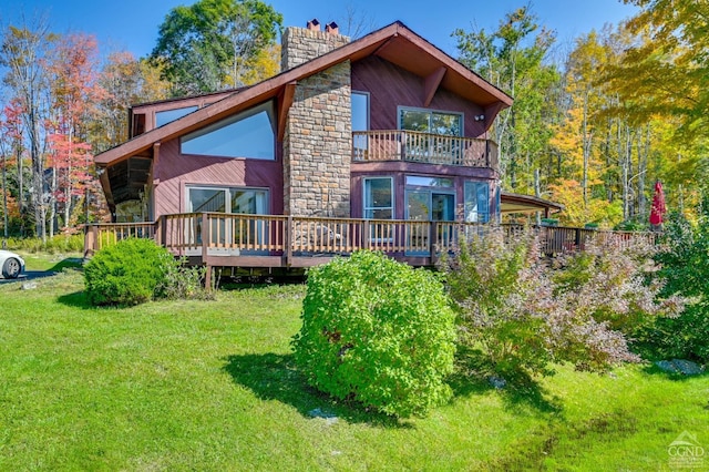 108 Botti Dr, Hunter, NY 12442 - rear view of property with a chimney, a balcony, a lawn, and stone siding