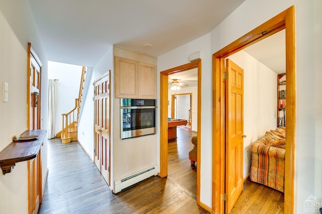 108 Botti Dr, Hunter, NY 12442 - corridor featuring baseboard heating, wood finished floors, and stairs
