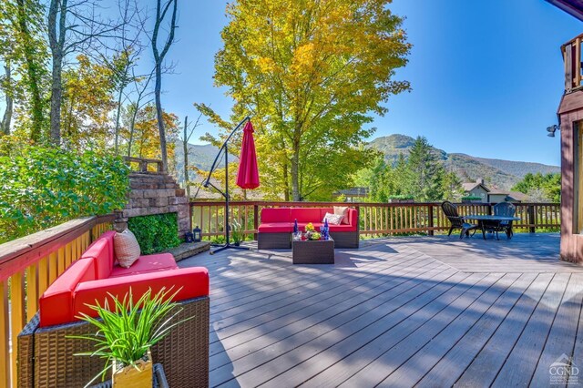 108 Botti Dr, Hunter, NY 12442 - wooden terrace featuring an outdoor living space with a fireplace and a mountain view