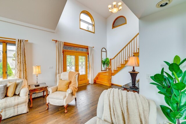 108 Botti Dr, Hunter, NY 12442 - foyer entrance featuring a towering ceiling, stairway, french doors, wood finished floors, and a chandelier