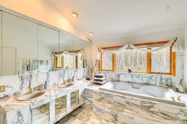 108 Botti Dr, Hunter, NY 12442 - bathroom with vaulted ceiling, a bath, double vanity, marble finish floors, and recessed lighting