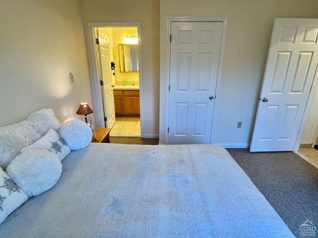 64 Liftside Dr Unit E-5, Hunter, NY 12442 - bedroom featuring carpet floors, baseboards, ensuite bath, and a sink