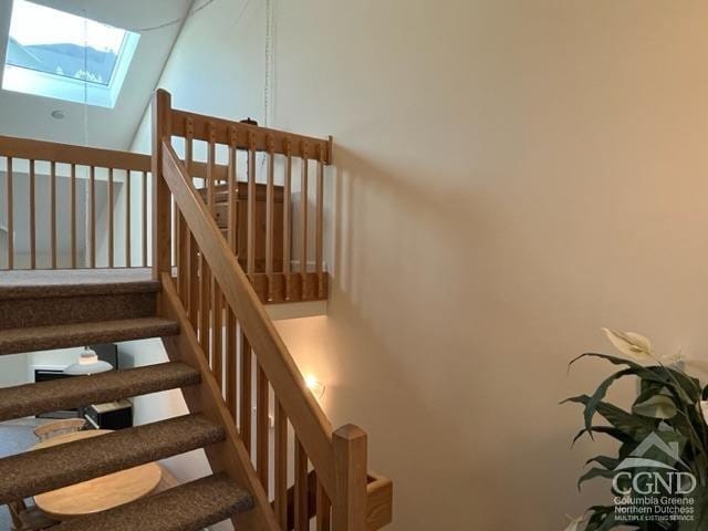 64 Liftside Dr Unit E-5, Hunter, NY 12442 - stairs with a skylight and high vaulted ceiling