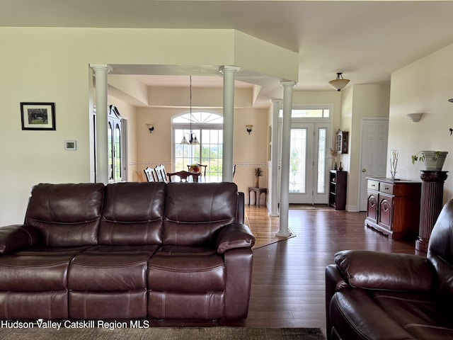 2914 Sleepy Hollow Rd, Athens, NY 12015 - living room with ornate columns and dark wood-style floors