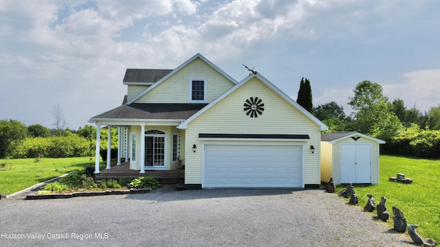 2914 Sleepy Hollow Rd, Athens, NY 12015 - traditional-style home with a storage unit, roof with shingles, a front lawn, and driveway