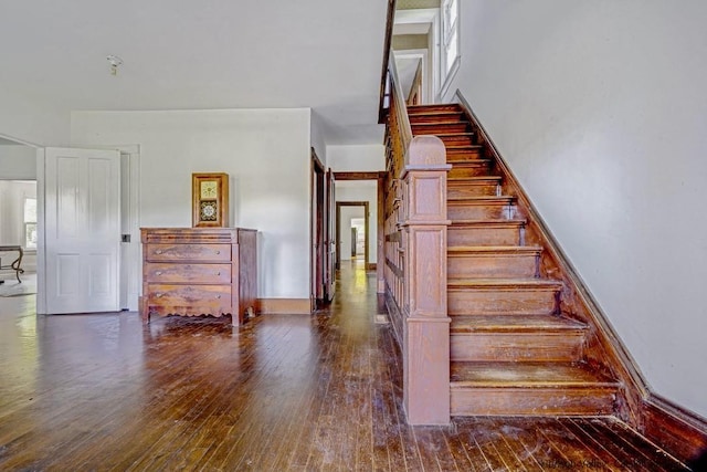 stairway featuring hardwood / wood-style flooring