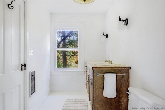 bathroom with tile patterned floors, vanity, and toilet