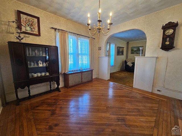 2322 US Route 9, Hudson, NY 12534 - unfurnished dining area featuring arched walkways, a chandelier, hardwood / wood-style floors, and wallpapered walls