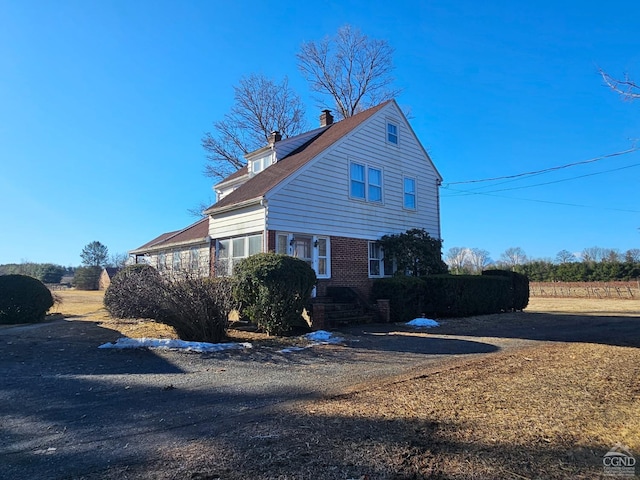 2322 US Route 9, Hudson, NY 12534 - view of side of home with a chimney