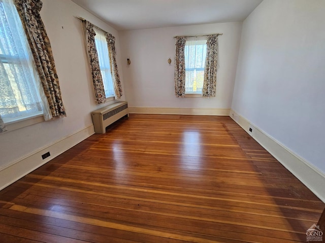 2322 US Route 9, Hudson, NY 12534 - unfurnished room featuring radiator, hardwood / wood-style flooring, and baseboards