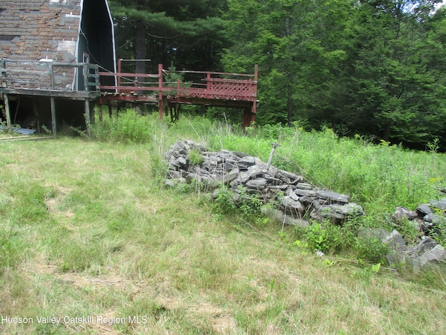 view of yard with a wooden deck