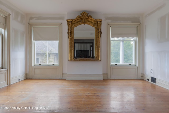 unfurnished living room with light wood-type flooring