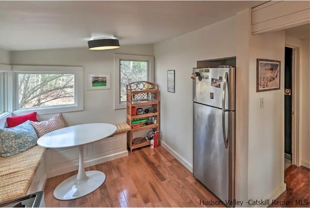 dining room featuring baseboards and wood finished floors