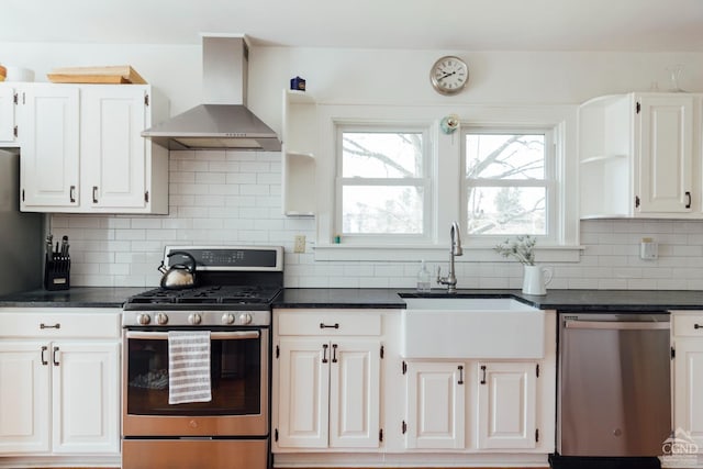 422 County Route 9, Ghent, NY 12075 - kitchen with stainless steel appliances, wall chimney exhaust hood, a sink, and dark countertops
