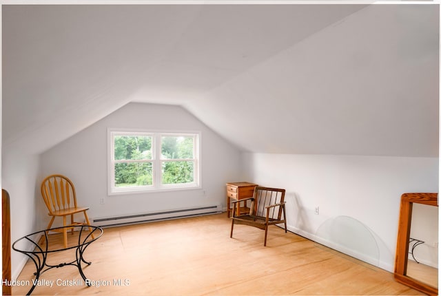 219 Rte 32, New Paltz, NY 12561 - sitting room with a baseboard radiator, wood finished floors, and vaulted ceiling