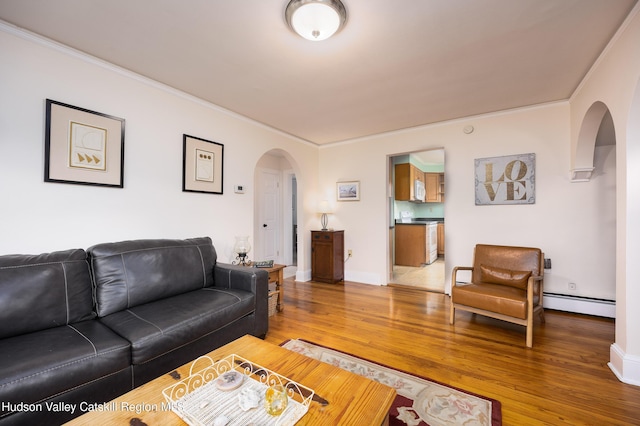 219 Rte 32, New Paltz, NY 12561 - living area with arched walkways, light wood-style flooring, a baseboard radiator, and crown molding