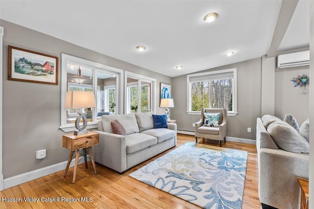 532 Springtown Rd, New Paltz, NY 12561 - living room featuring a wall mounted air conditioner, wood finished floors, baseboards, vaulted ceiling, and a baseboard heating unit