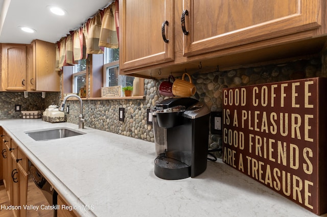 190 Deer Run Rd, Ashland, NY 12407 - kitchen featuring a sink, tasteful backsplash, light countertops, and brown cabinetry