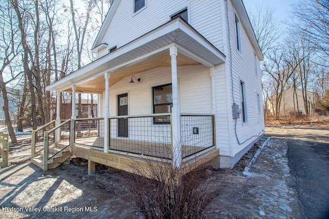 view of home's exterior with covered porch