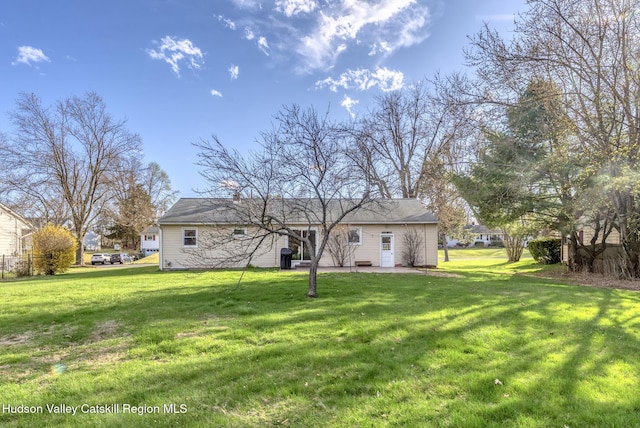 121 Rayna St, Hurley, NY 12443 - rear view of house with a lawn and a patio area