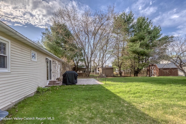 121 Rayna St, Hurley, NY 12443 - view of yard featuring a storage shed, an outbuilding, and a patio