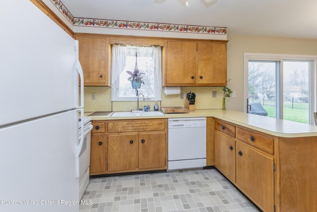 121 Rayna St, Hurley, NY 12443 - kitchen with white appliances, a sink, a peninsula, light countertops, and tasteful backsplash