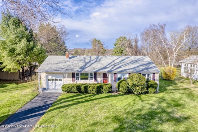121 Rayna St, Hurley, NY 12443 - ranch-style house featuring a chimney, asphalt driveway, and a front lawn