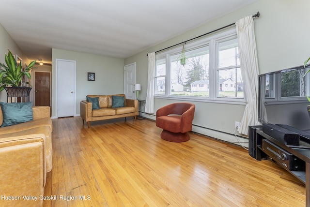 121 Rayna St, Hurley, NY 12443 - living room with a baseboard radiator and light wood finished floors