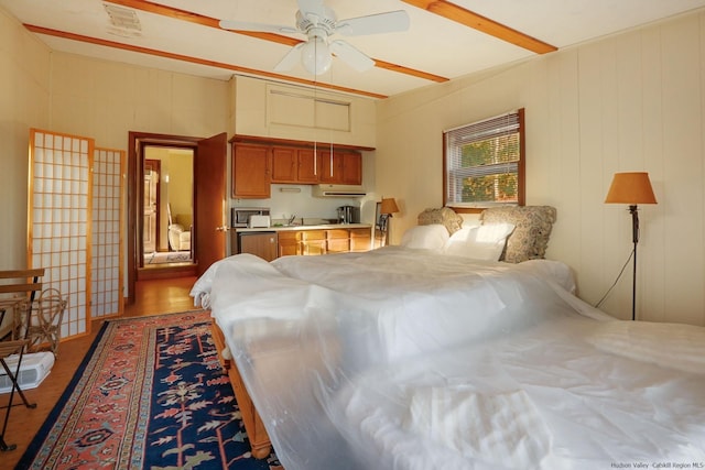 bedroom with ceiling fan and light hardwood / wood-style flooring