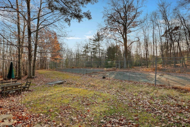 view of yard with tennis court