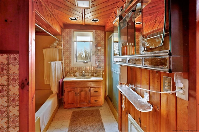 bathroom featuring wood ceiling, vanity, and shower / bath combination with curtain