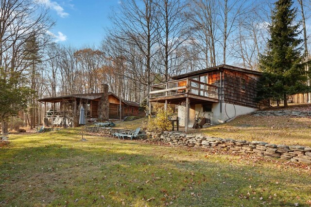 view of yard with a wooden deck