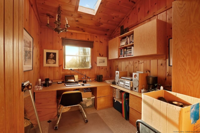 carpeted office with vaulted ceiling with skylight, wood walls, wooden ceiling, and a chandelier