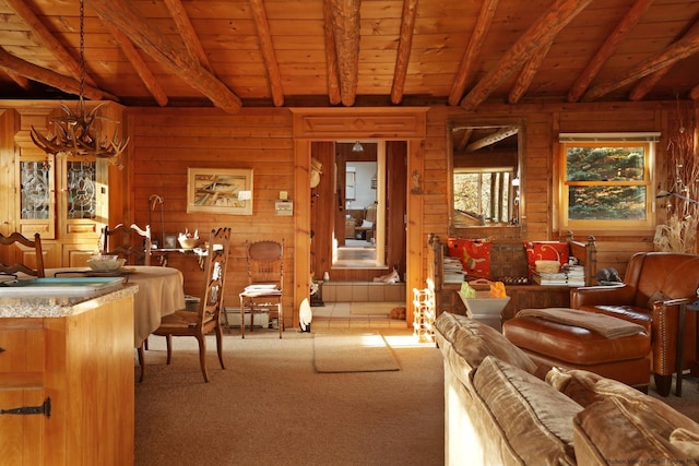 living room featuring beamed ceiling, wood ceiling, and an inviting chandelier