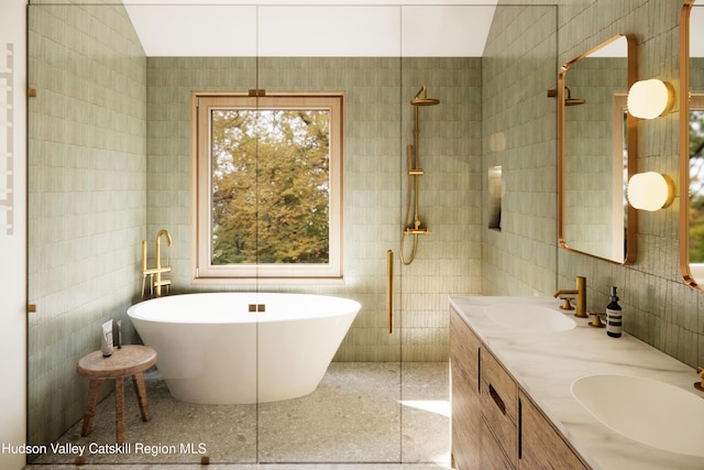 bathroom with vanity, separate shower and tub, and tile walls