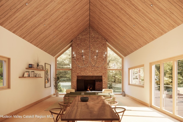 living room featuring plenty of natural light, a fireplace, and high vaulted ceiling