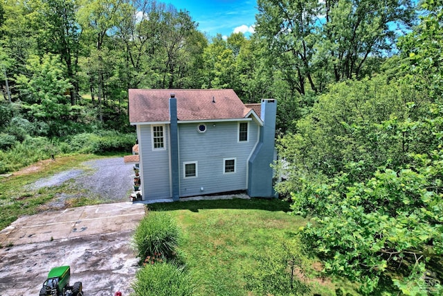 630 County Route 11, Ancram, NY 12502 - back of property featuring a chimney and a lawn