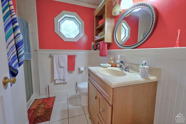 630 County Route 11, Ancram, NY 12502 - full bathroom featuring a shower stall, wainscoting, tile patterned flooring, vanity, and toilet
