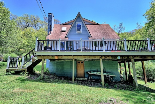 630 County Route 11, Ancram, NY 12502 - back of property featuring a wooden deck, a lawn, a chimney, and stairs