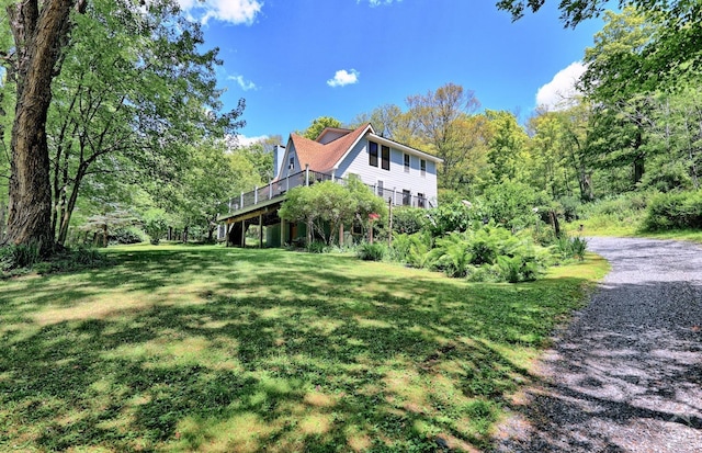 630 County Route 11, Ancram, NY 12502 - view of side of property with a lawn and a wooden deck