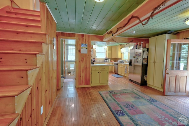 630 County Route 11, Ancram, NY 12502 - kitchen featuring stainless steel appliances, wood ceiling, light wood-style flooring, light countertops, and wood walls